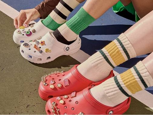 Legs with Crocs shoes on feet
